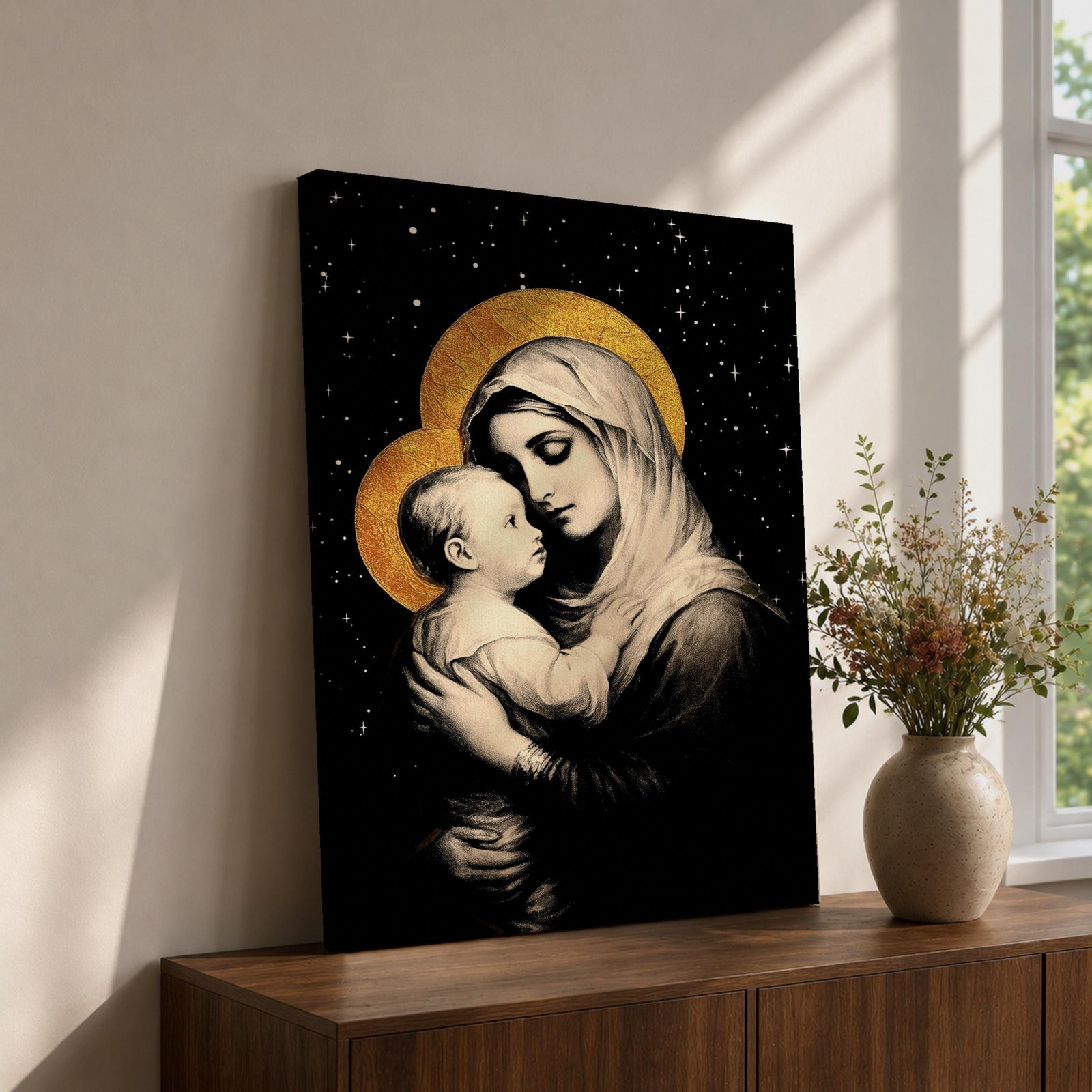 A framed canvas artwork depicting Madonna and Child with golden halos against a starry black background. The image shows the Virgin Mary tenderly holding the infant Jesus, rendered in a classical style with detailed shading and a serene expression, emphasizing their close bond.