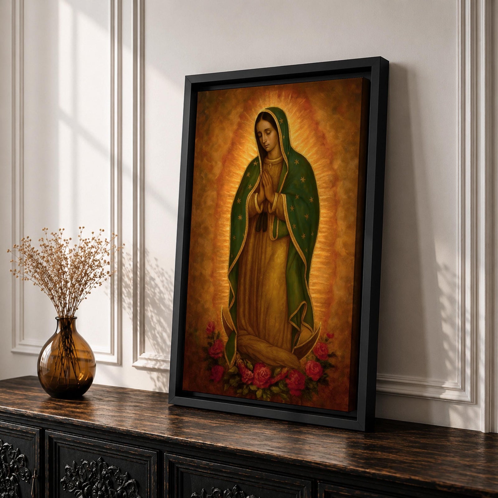Traditional devotional illustration of the Virgin of Guadalupe standing with hands clasped in prayer, wearing a rose colored gown and a teal mantle covered with gold stars, surrounded by radiant golden rays with a small angel beneath her, rendered in warm antique tones with delicate shading in a classic Mexican Catholic icon style.