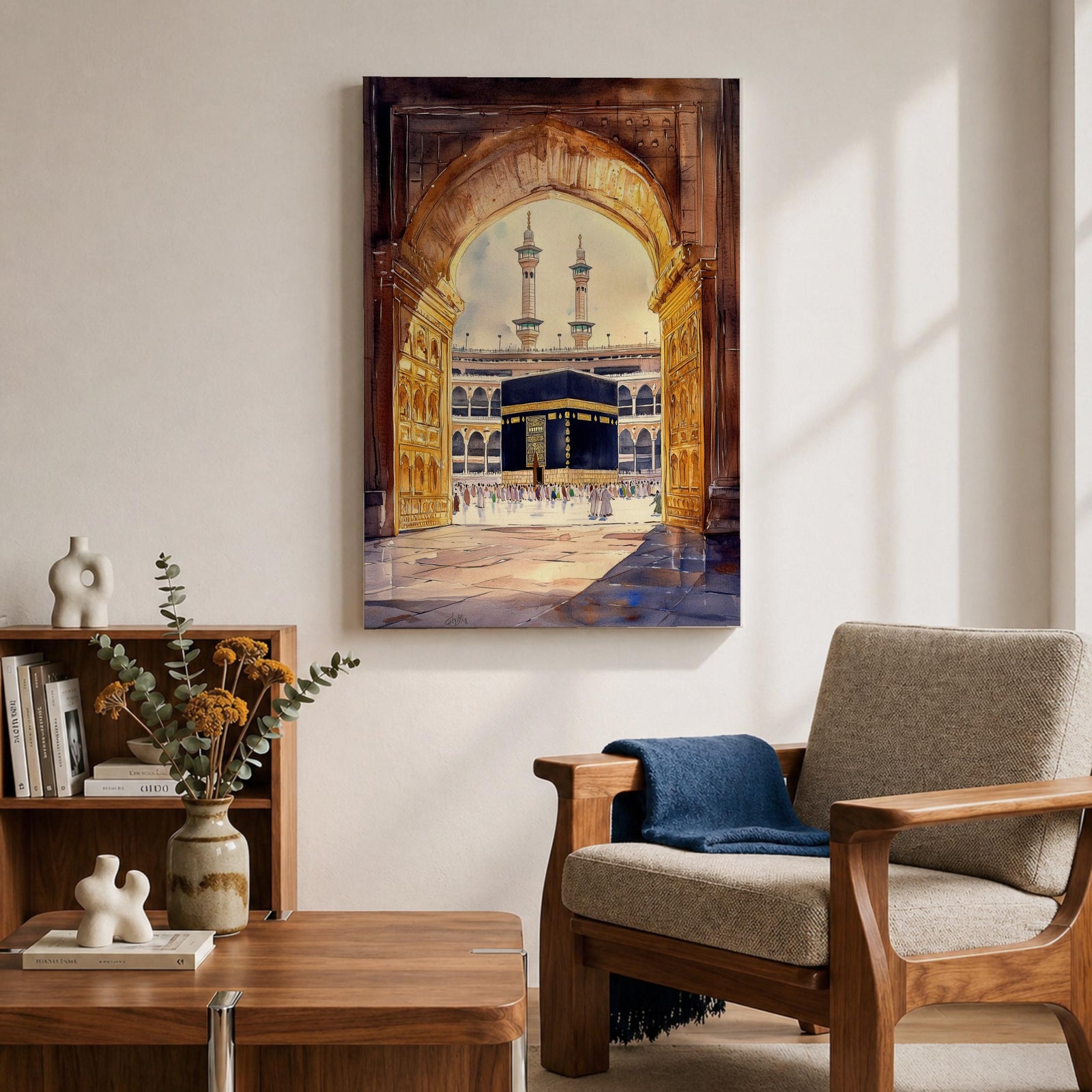 Watercolor-style artwork of the Kaaba at Masjid Al Haram in Mecca viewed through a grand mosque archway with open golden doors and pilgrims gathered in the courtyard beneath tall minarets.