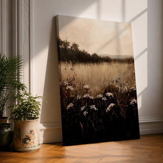 A framed canvas painting depicting a wildflower landscape with tall grasses and clusters of white wildflowers in the foreground, fading into a soft, hazy meadow and distant tree line under a muted sky, rendered in a naturalistic style emphasizing texture and depth.