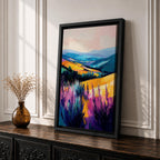 A vibrant oil painting of a lavender field featuring tall purple blooms in the foreground with rolling golden hills and blue mountains in the background. The brushstrokes are expressive and textured, capturing the natural beauty of a rustic botanical landscape in a colorful, realistic style.