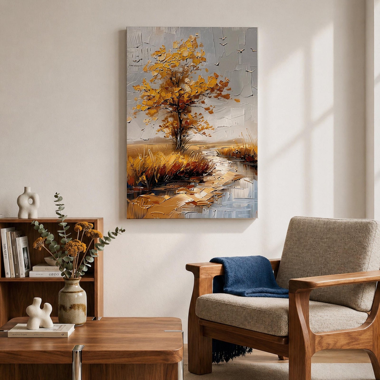 A textured impasto painting of a golden tree with autumn leaves beside a winding stream in a natural landscape. The artwork features thick brush strokes creating depth and movement with a muted sky and flying birds in the background.