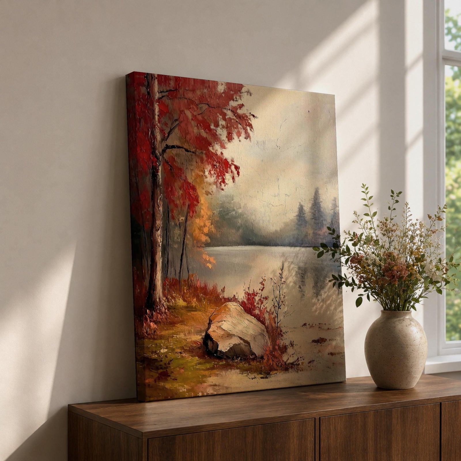 A vintage style framed canvas painting depicting an autumn lake scene with vibrant red and orange trees, a large rock by the water's edge, and a misty forest reflected in the calm lake surface, capturing a peaceful natural landscape.