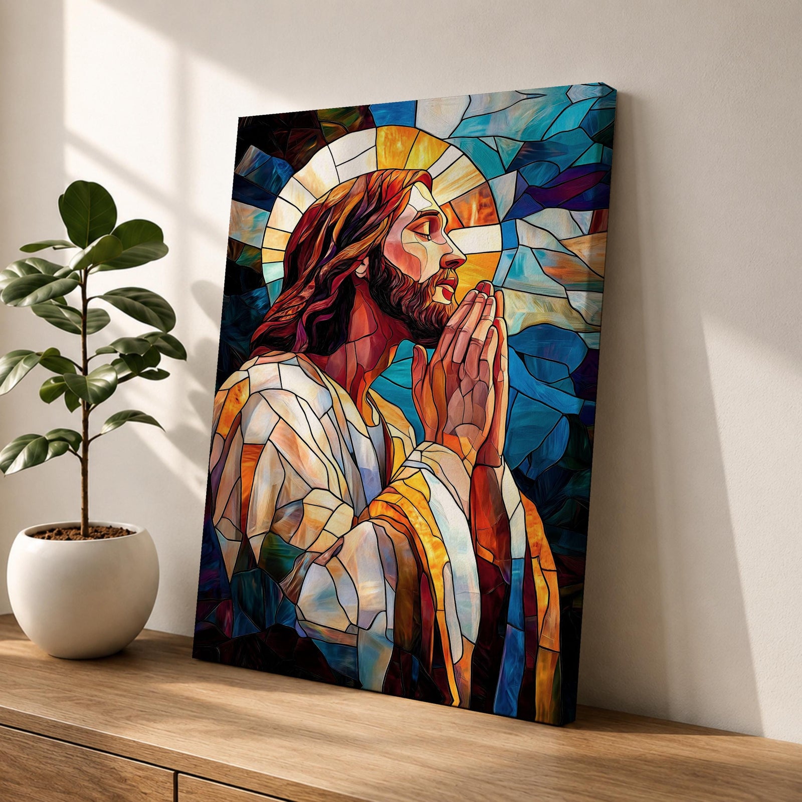 Modern stained glass style illustration of Jesus Christ shown praying with hands clasped and head bowed, portrayed with a calm expression and soft halo, composed of luminous jewel toned glass segments and radiant light patterns, rendered with clean lines and glowing color in a contemporary Christian devotional composition.