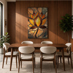 This artwork features a stained glass style depiction of a lotus flower with glowing amber and brown tones. The design mimics the segmented, textured look of stained glass panels, emphasizing the flower’s petals and stem in a mosaic-like arrangement, capturing a botanical and meditative essence.
