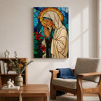 Modern stained glass style illustration of the Virgin Mary shown praying with hands clasped and head gently bowed, wearing flowing robes and a soft halo, composed of luminous jewel toned glass segments and radiant light patterns, rendered with clean lines and glowing color in a contemporary Marian devotional composition.