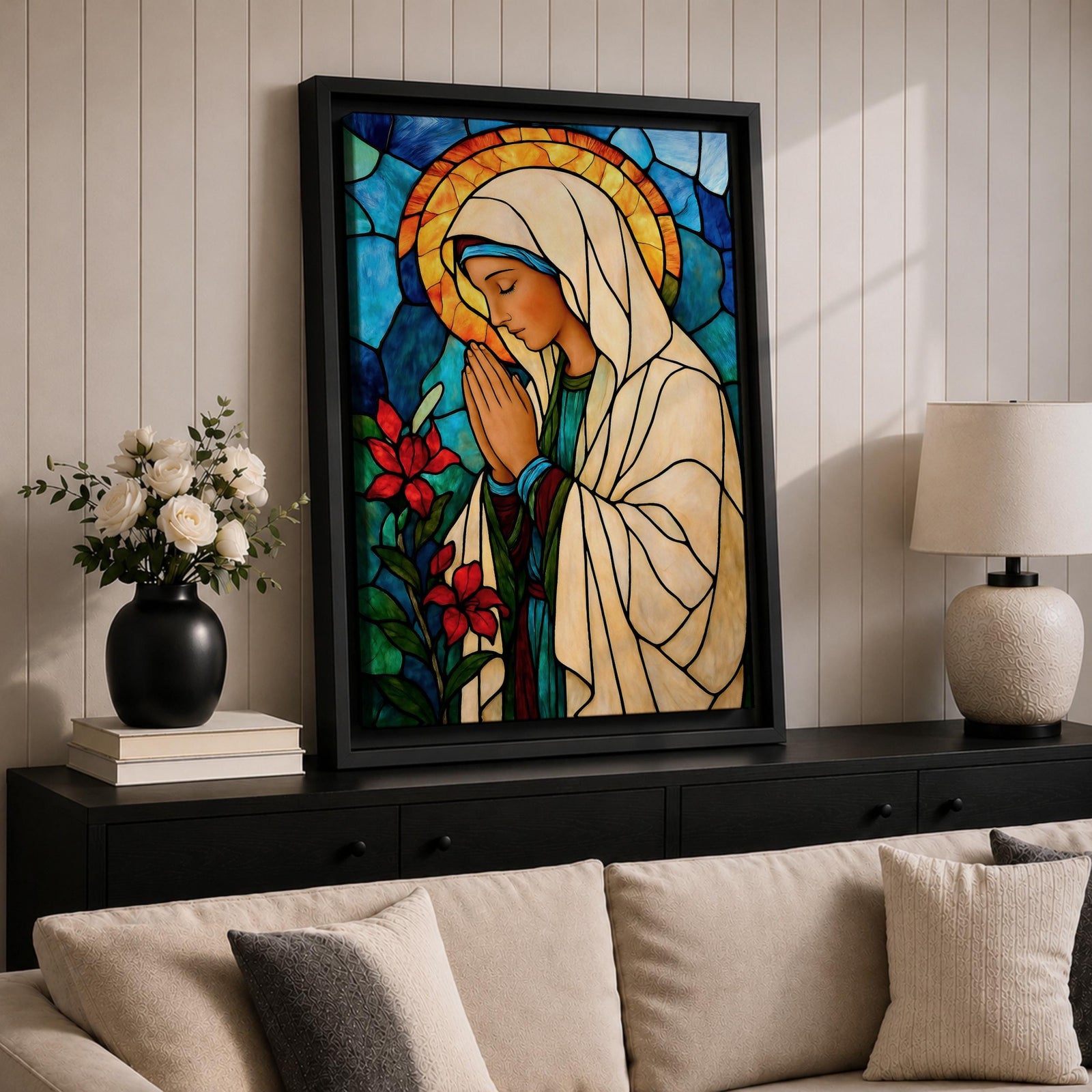 Modern stained glass style illustration of the Virgin Mary shown praying with hands clasped and head gently bowed, wearing flowing robes and a soft halo, composed of luminous jewel toned glass segments and radiant light patterns, rendered with clean lines and glowing color in a contemporary Marian devotional composition.
