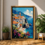 This impasto style framed canvas depicts the Amalfi Coast featuring a cluster of Italian villas with terracotta roofs perched on cliffs overlooking a vibrant blue Mediterranean sea under a partly cloudy sky, with colorful flowers in the foreground enhancing the coastal landscape scene.