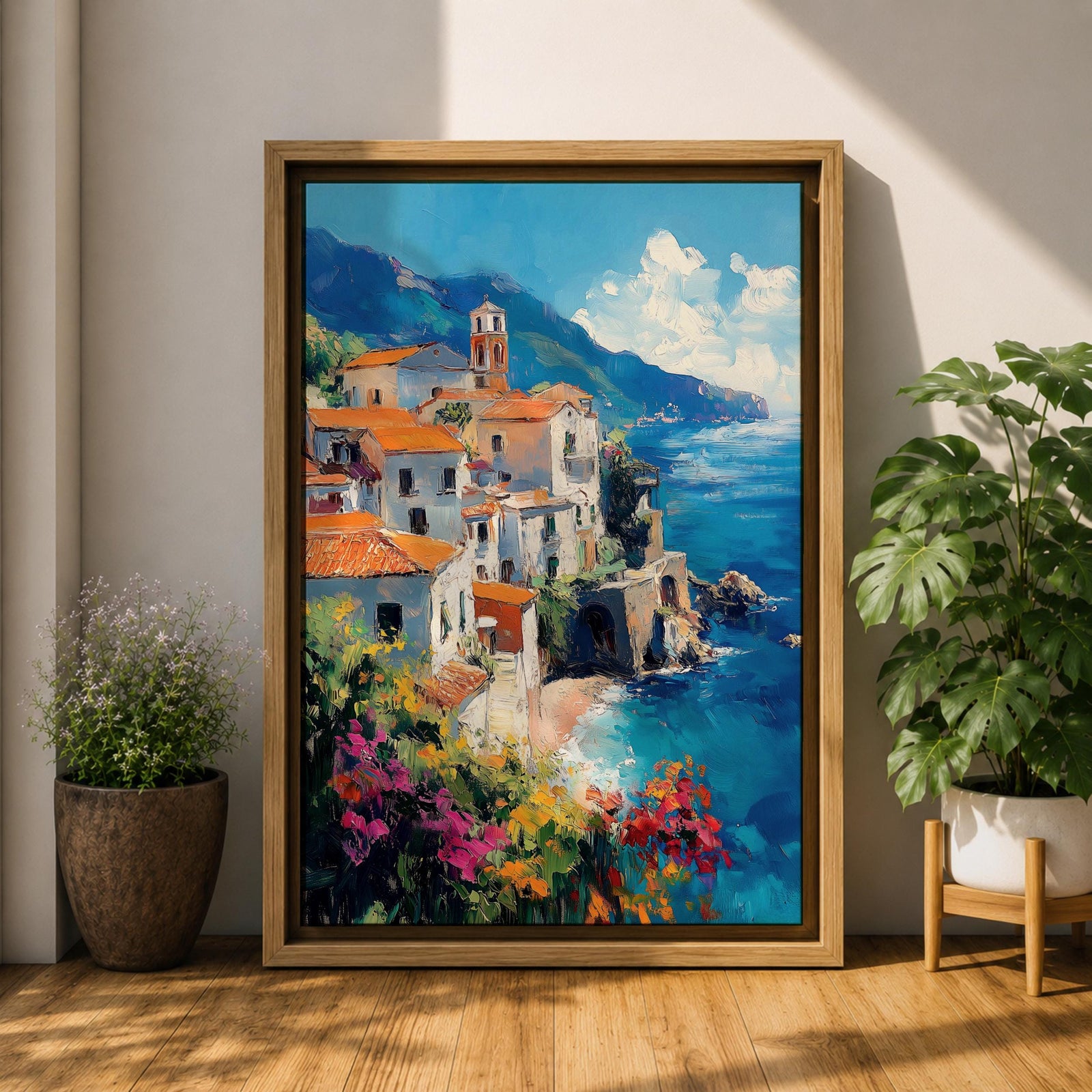 This impasto style framed canvas depicts the Amalfi Coast featuring a cluster of Italian villas with terracotta roofs perched on cliffs overlooking a vibrant blue Mediterranean sea under a partly cloudy sky, with colorful flowers in the foreground enhancing the coastal landscape scene.