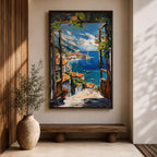 A vibrant framed canvas painting depicting a Mediterranean window opening to a coastal seaside view with terracotta rooftops, boats on deep blue ocean waters, and distant mountains under a bright sky. The artwork captures a scenic landscape with detailed brushstrokes and rich textures.