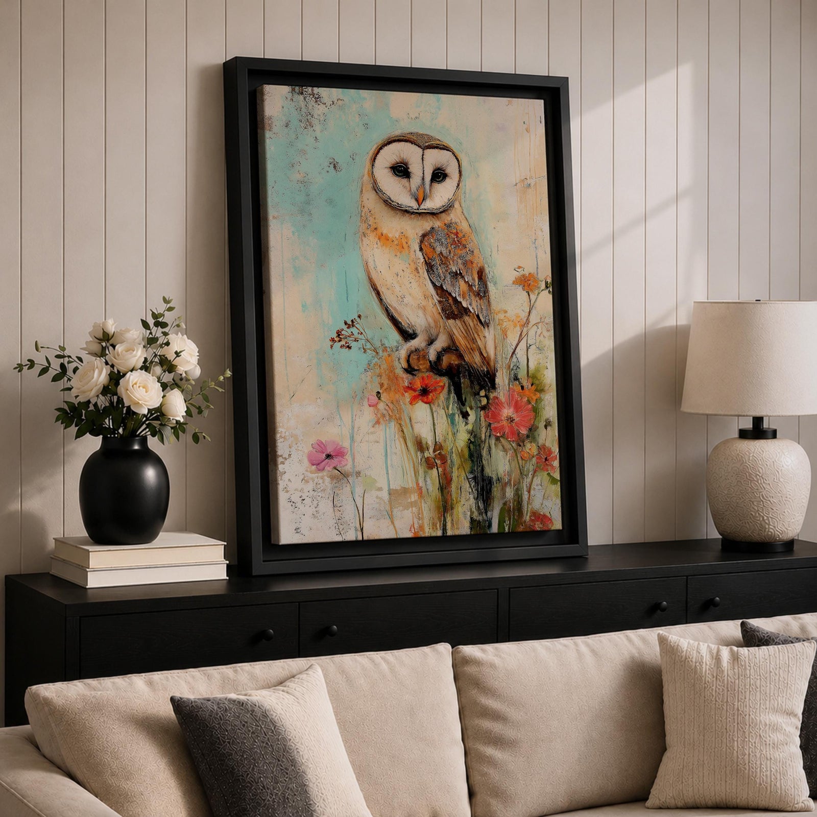 A detailed vintage-style framed canvas art print depicting a barn owl perched on a branch surrounded by wildflowers. The artwork features a rustic, naturalistic approach with soft textures and muted colors, capturing the essence of wildlife and farmhouse charm in a classic animal portrait style.