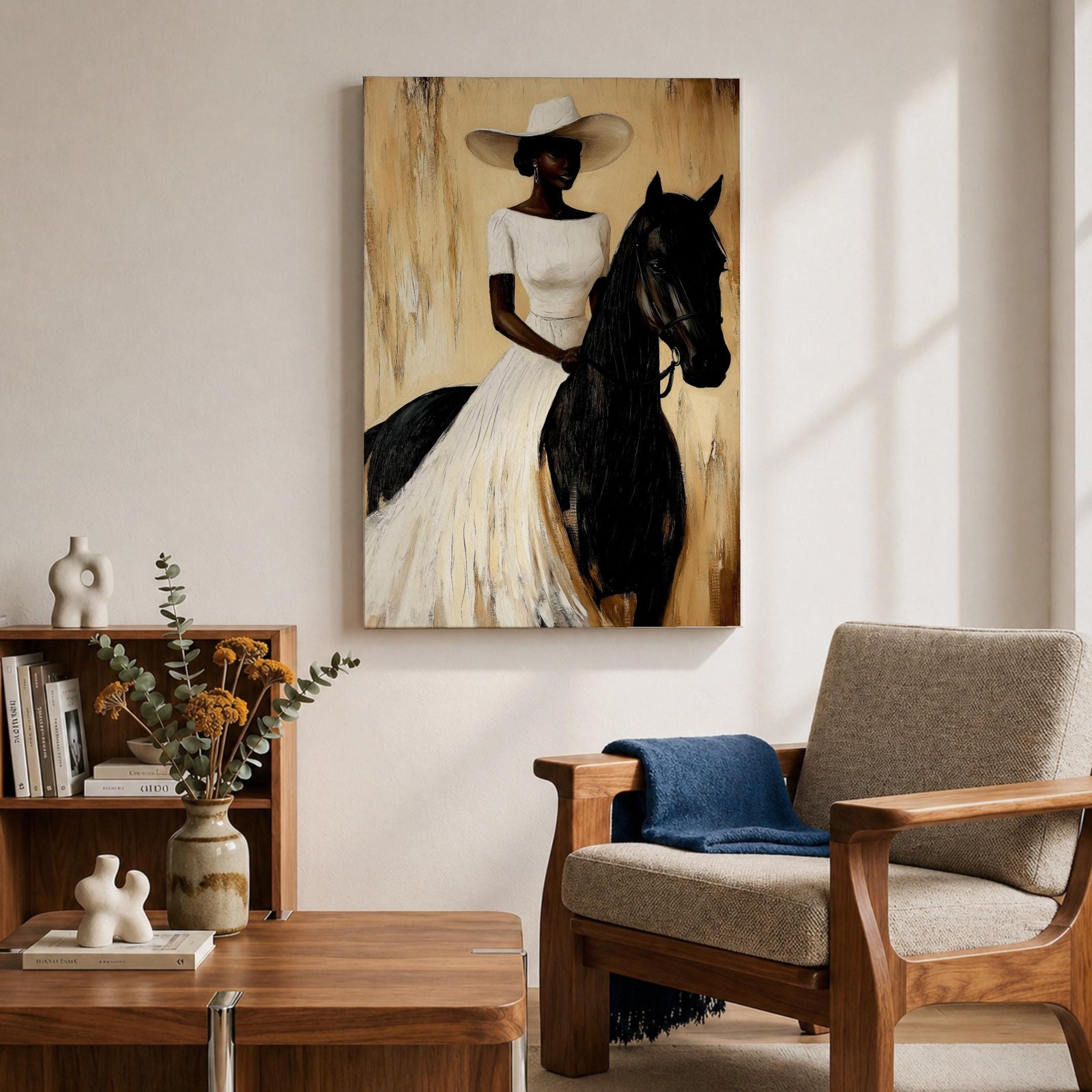 A framed painting of a woman dressed in a white dress and wide-brimmed hat riding a black horse. The artwork features a realistic style with warm beige and brown tones in the background, emphasizing the elegant posture of the rider and the horse’s strong presence.
