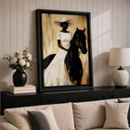A framed painting of a woman dressed in a white dress and wide-brimmed hat riding a black horse. The artwork features a realistic style with warm beige and brown tones in the background, emphasizing the elegant posture of the rider and the horse’s strong presence.