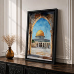 Masjid Al-Aqsa wall art showing the golden Dome of the Rock in Jerusalem framed through a historic stone archway. Islamic canvas artwork featuring the sacred mosque courtyard and architectural arches, perfect for Muslim home decor and mosque-inspired wall art.