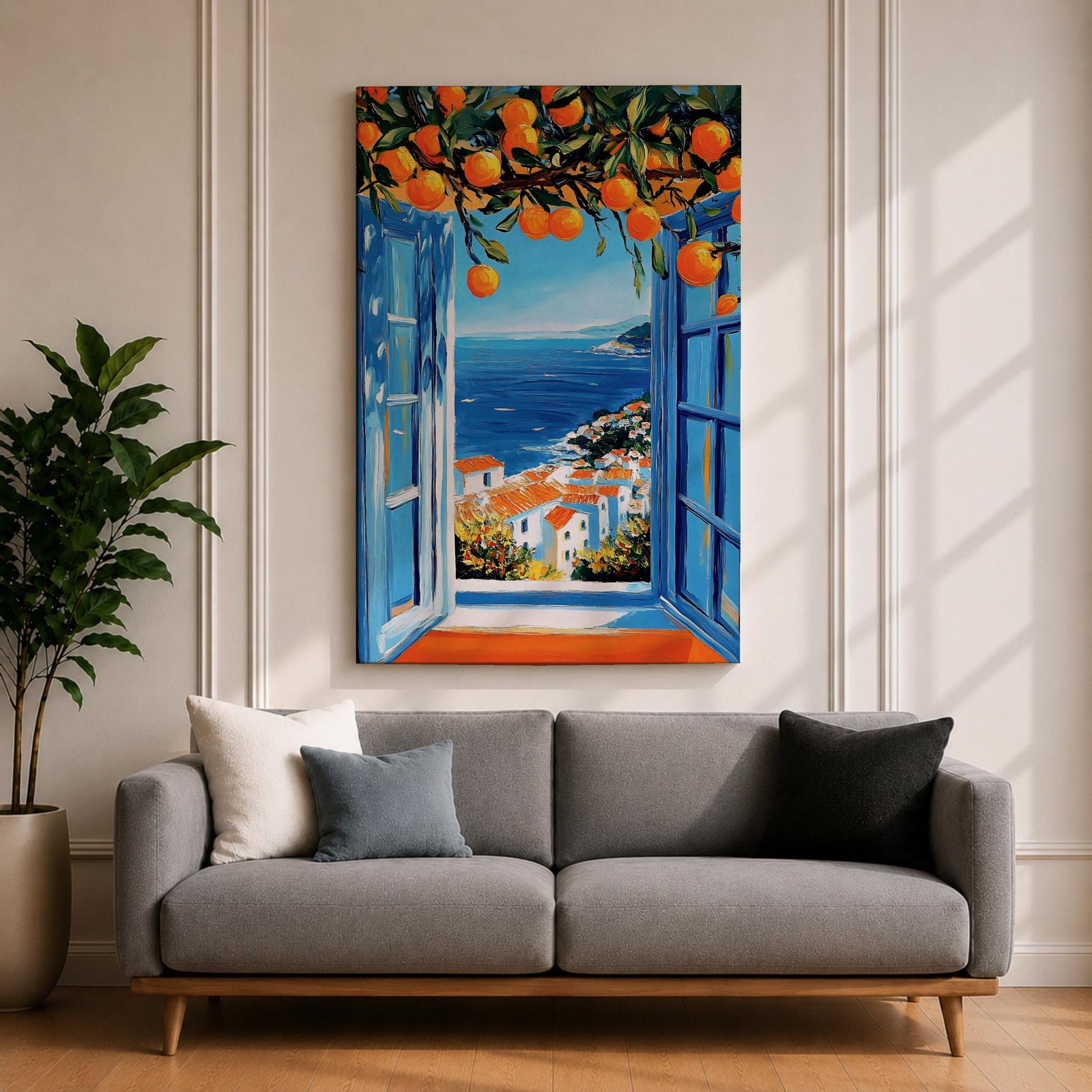 A vibrant framed canvas painting depicting an open Mediterranean-style window with blue shutters overlooking a coastal landscape. Above the window, ripe orange fruits hang from branches, framing a scenic view of white houses with terracotta roofs and a deep blue sea under a clear sky, rendered in a vivid, realistic style.