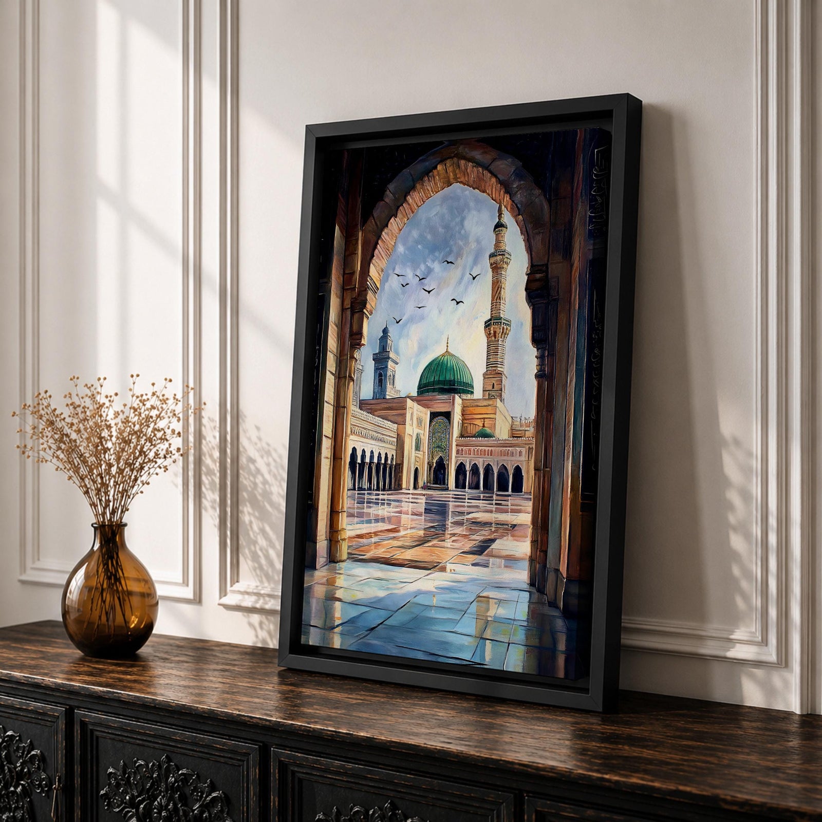 Painting of Masjid Nabawi in Medina seen through a grand stone archway, showing the iconic green dome, tall minaret, and reflective marble courtyard with birds flying above the sacred Prophet’s Mosque and detailed Islamic architectural arches framing the serene mosque complex.