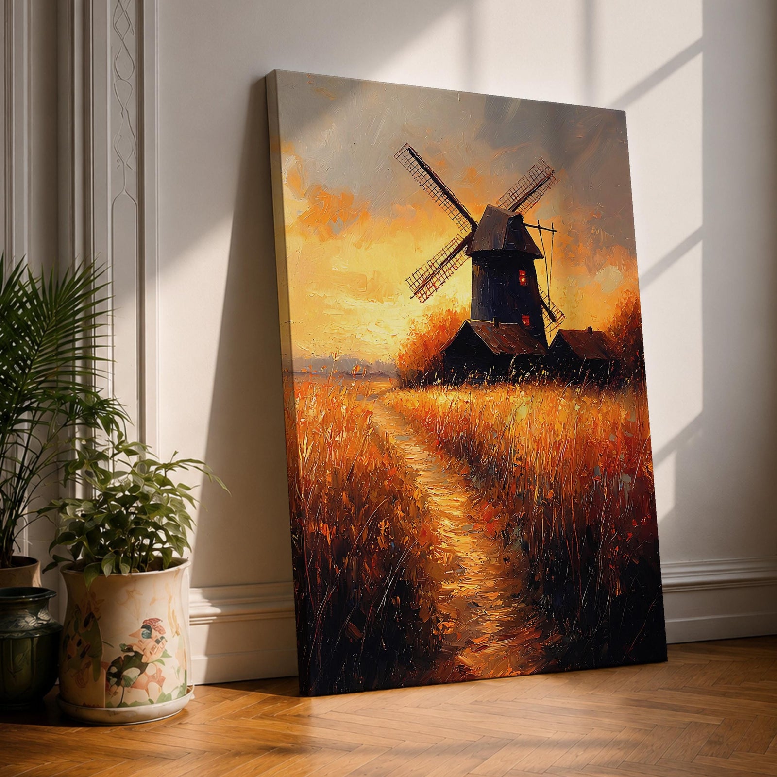 A textured vintage-style painting of a windmill standing amidst tall golden grasses with a glowing sunset sky in the background. The artwork features rich impasto brushstrokes emphasizing the rustic farmhouse atmosphere and a winding path leading toward the dark silhouette of the mill and adjacent buildings.