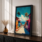 A vibrant painting depicting a tropical beach village with colorful houses lining a descending street toward the ocean. Palm trees rise above the rooftops under a bright blue sky with fluffy clouds. The artwork captures a lively coastal town atmosphere in a bold, illustrative style.
