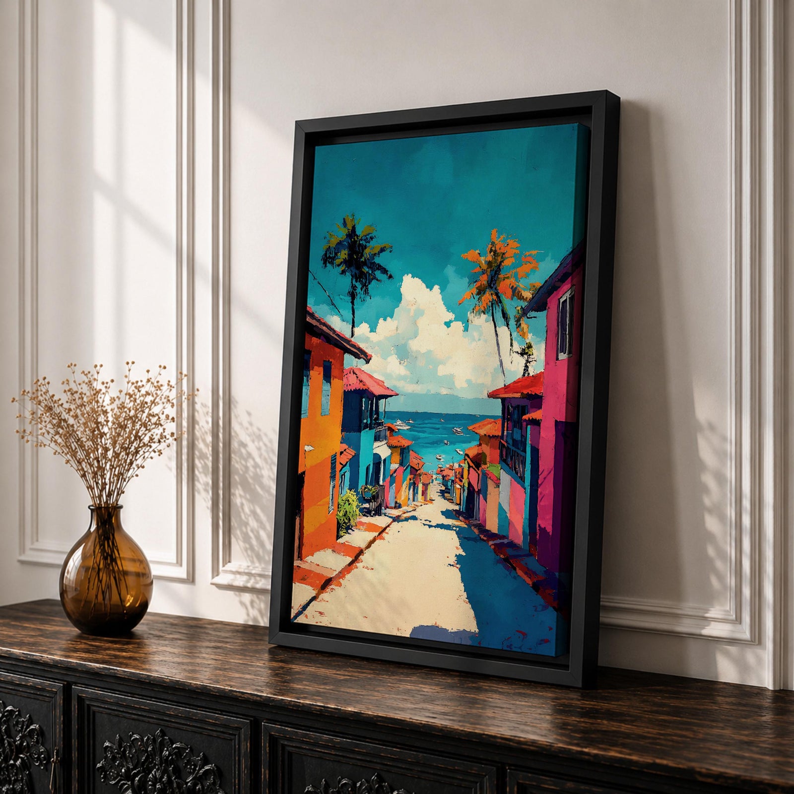 A vibrant painting depicting a tropical beach village with colorful houses lining a descending street toward the ocean. Palm trees rise above the rooftops under a bright blue sky with fluffy clouds. The artwork captures a lively coastal town atmosphere in a bold, illustrative style.