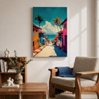 A vibrant painting depicting a tropical beach village with colorful houses lining a descending street toward the ocean. Palm trees rise above the rooftops under a bright blue sky with fluffy clouds. The artwork captures a lively coastal town atmosphere in a bold, illustrative style.