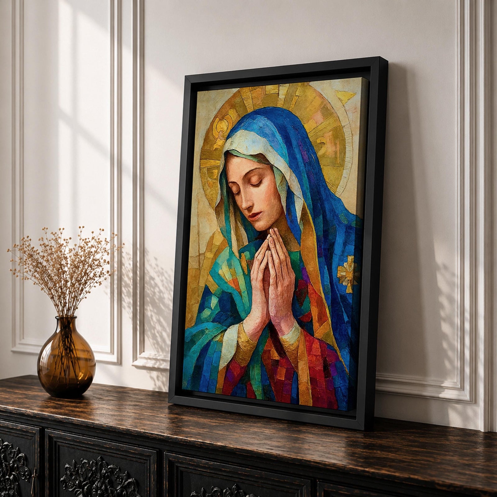 Mosaic style portrait of the Blessed Virgin Mary shown with eyes gently lowered and hands folded in prayer, wearing a blue veil and layered robes while a radiant golden halo composed of geometric tile shapes forms behind her head, rendered in a stained glass inspired composition with textured brushwork and devotional Madonna iconography.
