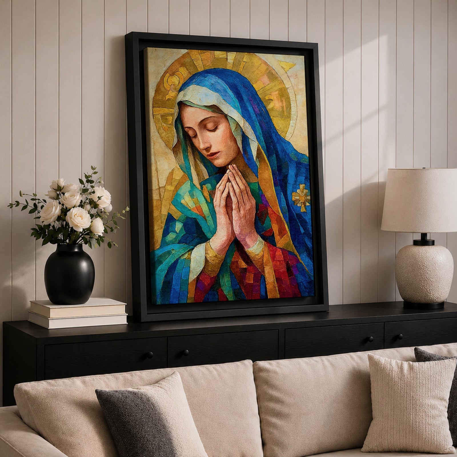Mosaic style portrait of the Blessed Virgin Mary shown with eyes gently lowered and hands folded in prayer, wearing a blue veil and layered robes while a radiant golden halo composed of geometric tile shapes forms behind her head, rendered in a stained glass inspired composition with textured brushwork and devotional Madonna iconography.