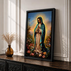 A detailed framed canvas print depicting Our Lady of Guadalupe, also known as the Virgin of Guadalupe, standing with hands clasped in prayer, surrounded by radiant light and floral elements, rendered in a realistic and vibrant style emphasizing religious Catholic iconography.