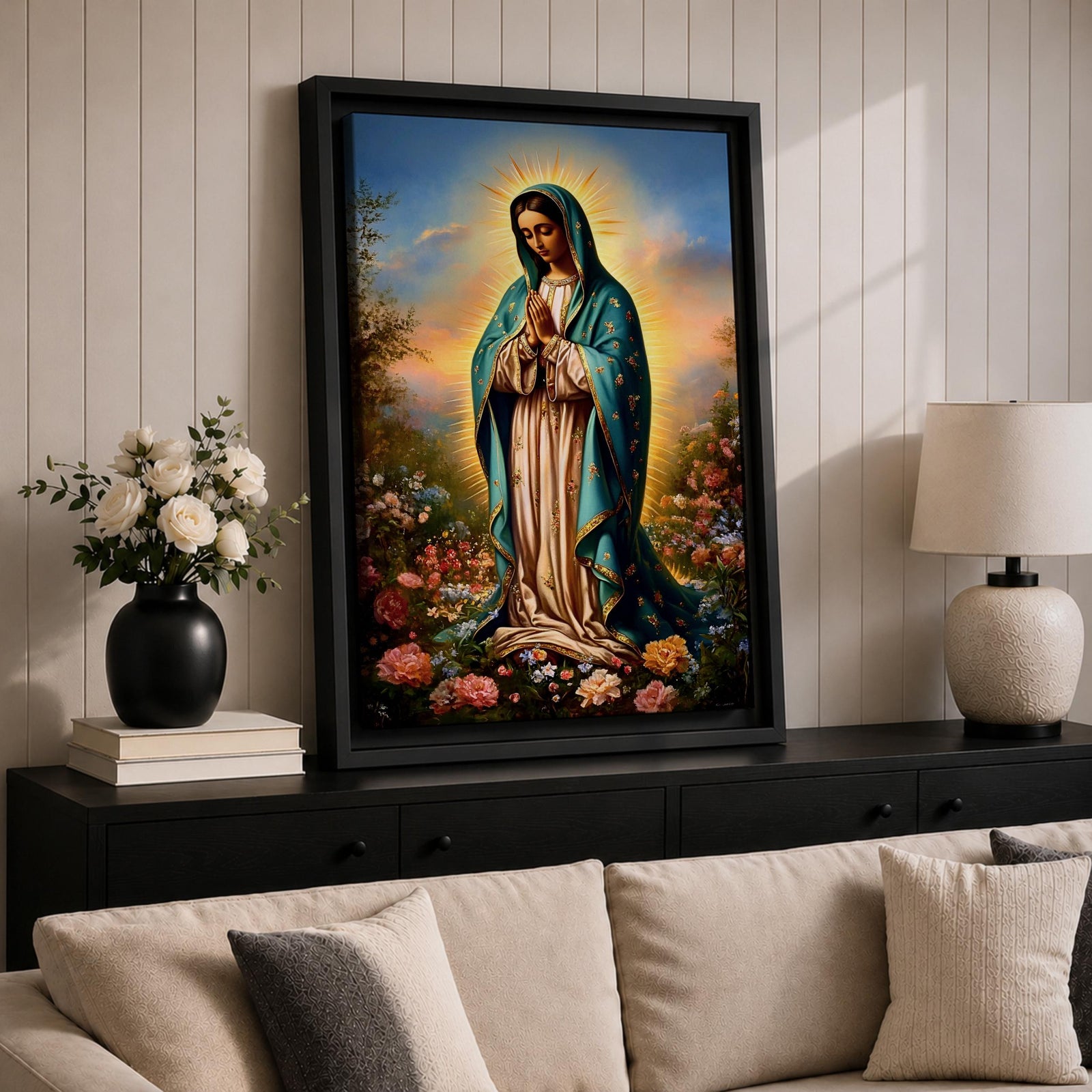 A detailed framed canvas print depicting Our Lady of Guadalupe, also known as the Virgin of Guadalupe, standing with hands clasped in prayer, surrounded by radiant light and floral elements, rendered in a realistic and vibrant style emphasizing religious Catholic iconography.
