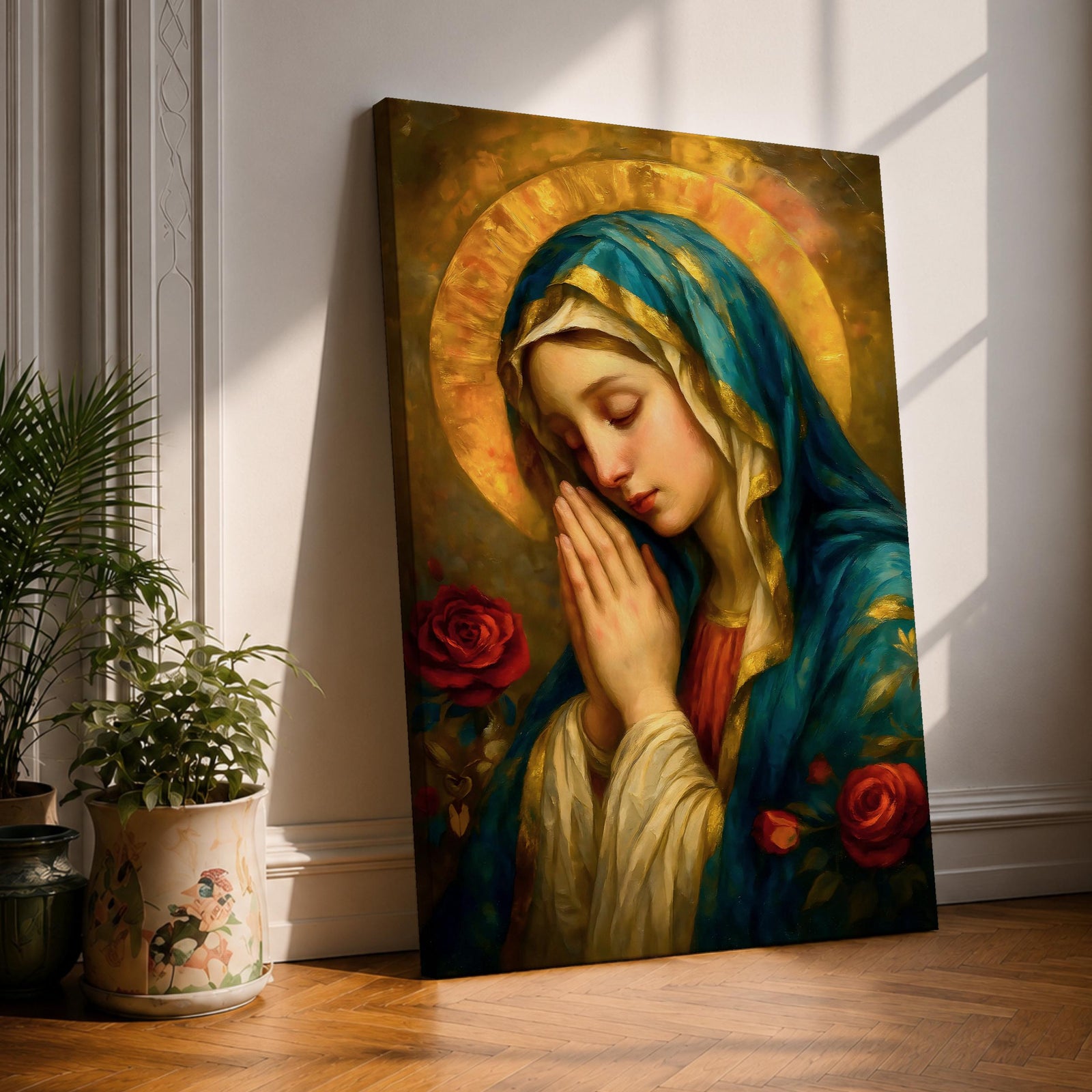 Portrait painting of the Blessed Virgin Mary shown with eyes gently closed and hands clasped in prayer, wearing a blue veil and cream garment while a radiant golden halo glows behind her head, with red roses appearing beside her in a devotional Madonna composition rendered in a soft classical style with warm painterly brushwork.