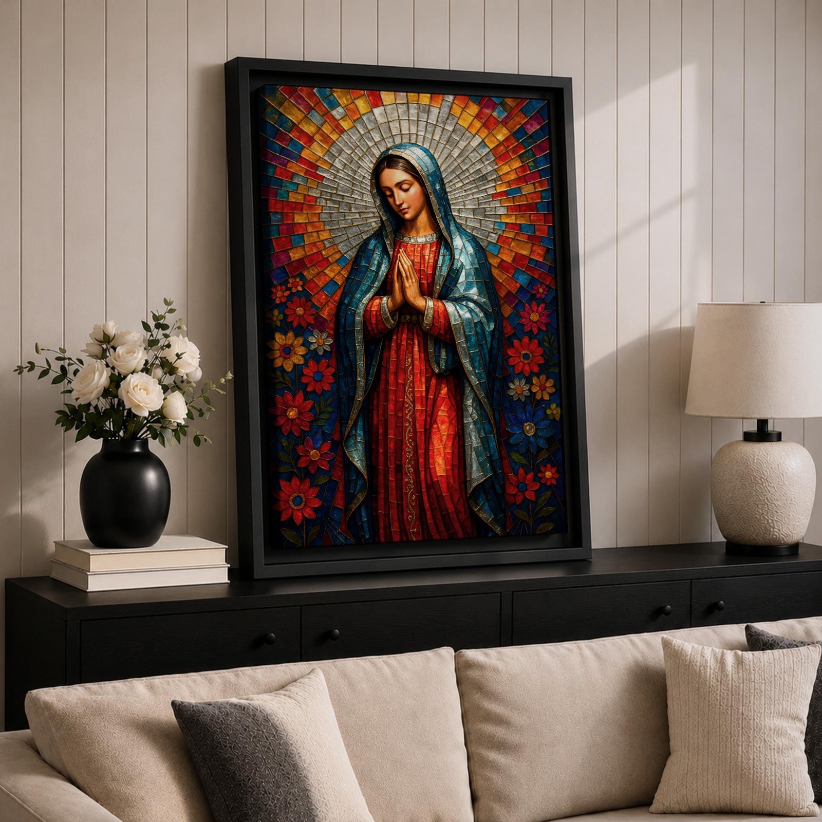 Mosaic style portrait of Our Lady of Guadalupe standing with hands folded in prayer, wearing a blue mantle over a red gown while a radiant circular halo of colorful geometric tiles spreads outward behind her head, surrounded by stylized flowers that frame the Virgen in a devotional composition inspired by stained glass mosaic artwork.