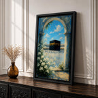 A watercolor painting depicting the Kaaba framed by a floral arch with white blossoms and stone columns, set against a bright blue sky with soft clouds, capturing the iconic Islamic holy site in Mecca with delicate brushwork and vibrant colors.