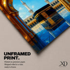 A vibrant framed canvas artwork depicting the Kaaba viewed through a golden arched doorway at Masjid Al Haram in Mecca. The scene shows the iconic black cube structure with gold detailing, two minarets in the background, and a reflective tiled floor under a bright blue sky with birds flying.