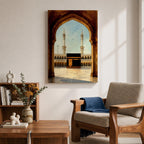 A watercolor style framed canvas depicting the Kaaba viewed through an arched gateway, showing the black cube structure with golden door and surrounding mosque minarets under a clear sky with flying birds, rendered in warm tones and detailed architectural elements.
