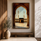 A watercolor style framed canvas depicting the Kaaba viewed through an arched gateway, showing the black cube structure with golden door and surrounding mosque minarets under a clear sky with flying birds, rendered in warm tones and detailed architectural elements.