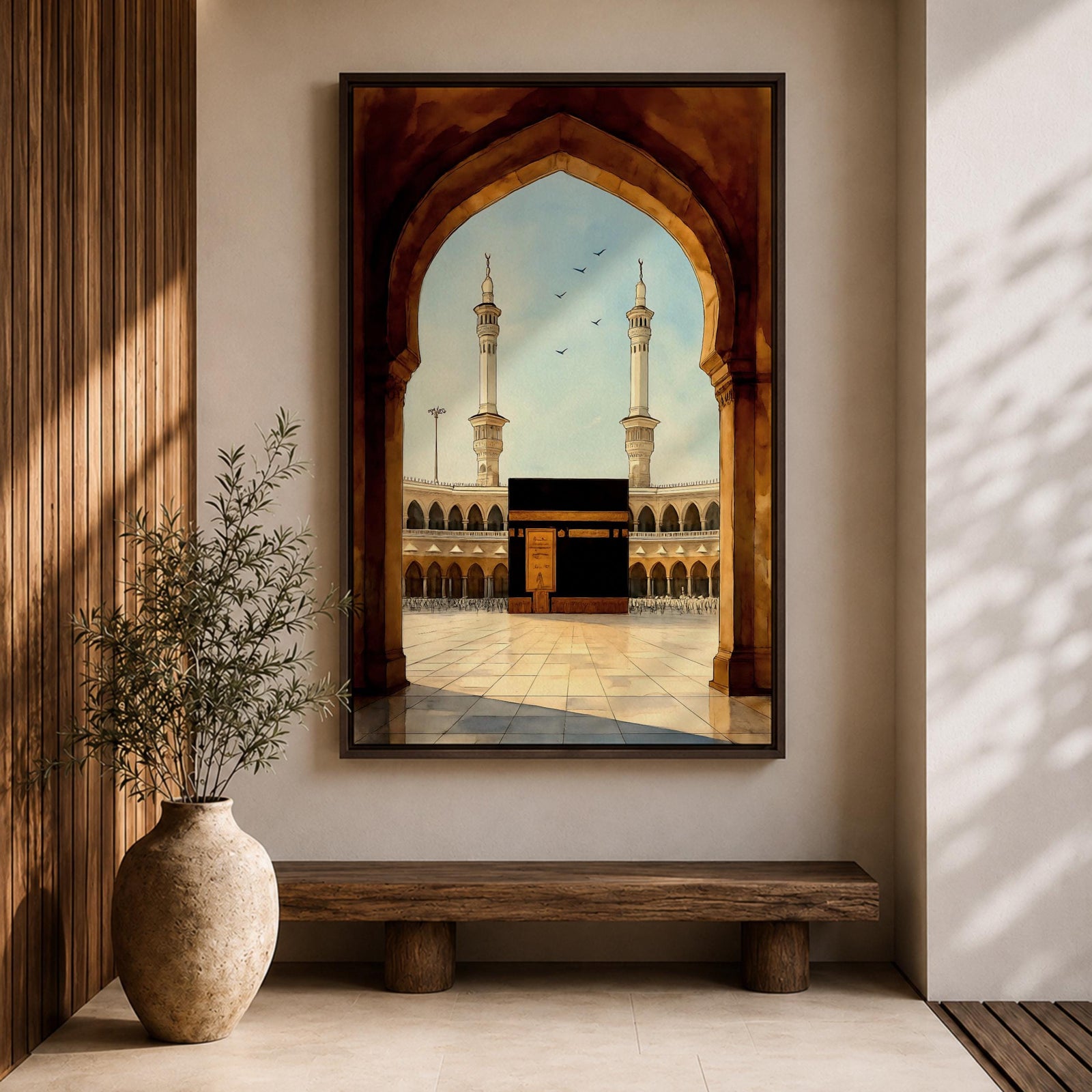 A watercolor style framed canvas depicting the Kaaba viewed through an arched gateway, showing the black cube structure with golden door and surrounding mosque minarets under a clear sky with flying birds, rendered in warm tones and detailed architectural elements.