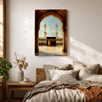 A watercolor style framed canvas depicting the Kaaba viewed through an arched gateway, showing the black cube structure with golden door and surrounding mosque minarets under a clear sky with flying birds, rendered in warm tones and detailed architectural elements.