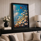 This impasto style framed canvas features a vibrant monarch butterfly fluttering above a cluster of white daisies with yellow centers against a textured blue sky background. The thick brushstrokes create a rich, textured floral composition emphasizing natural beauty and butterfly life in a lively garden scene.
