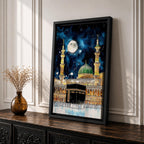 Painting of the Kaaba at Masjid Al Haram under a night sky filled with stars and a large full moon, surrounded by illuminated mosque arcades and tall minarets with pilgrims gathered around the sacred cube, while the green dome of Masjid Al Nabawi appears in the background within the composition.