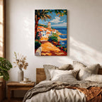 A vibrant Mediterranean coastal scene painted in bold brushstrokes depicts a charming beach house with terracotta roofs beside the deep blue ocean under a bright sky with scattered clouds. Lush greenery and colorful flowers frame the pathway leading to the water, rendered in a lively impressionistic style.