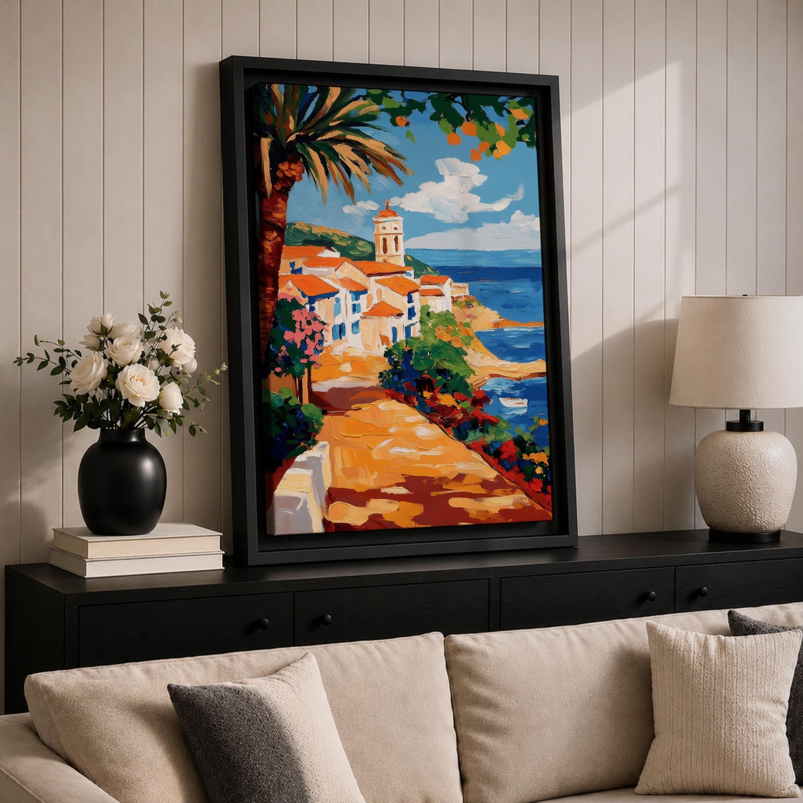 A vibrant Mediterranean coastal scene painted in bold brushstrokes depicts a charming beach house with terracotta roofs beside the deep blue ocean under a bright sky with scattered clouds. Lush greenery and colorful flowers frame the pathway leading to the water, rendered in a lively impressionistic style.