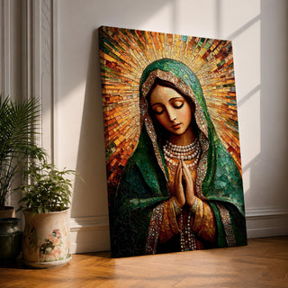 Mosaic style portrait of the Virgin Mary shown with head bowed and hands clasped in prayer, composed of small tile like fragments forming a devotional Catholic image. Radiant rays expand behind her while a detailed veil and necklace are rendered in textured mosaic pieces typical of religious icon artwork.