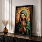 Mosaic style portrait of the Virgin Mary shown with head bowed and hands clasped in prayer, composed of small tile like fragments forming a devotional Catholic image. Radiant rays expand behind her while a detailed veil and necklace are rendered in textured mosaic pieces typical of religious icon artwork.
