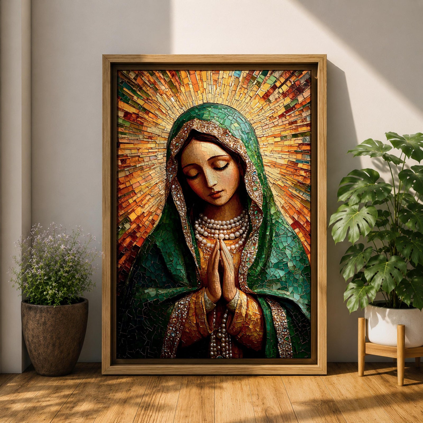 Mosaic style portrait of the Virgin Mary shown with head bowed and hands clasped in prayer, composed of small tile like fragments forming a devotional Catholic image. Radiant rays expand behind her while a detailed veil and necklace are rendered in textured mosaic pieces typical of religious icon artwork.