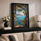 A framed canvas artwork depicting a Mediterranean balcony opening onto a vibrant coastal ocean view with sailboats on the water and leafy branches framing the scene. The style is realistic with bold, clear lines and vivid colors emphasizing the natural landscape and architectural elements.