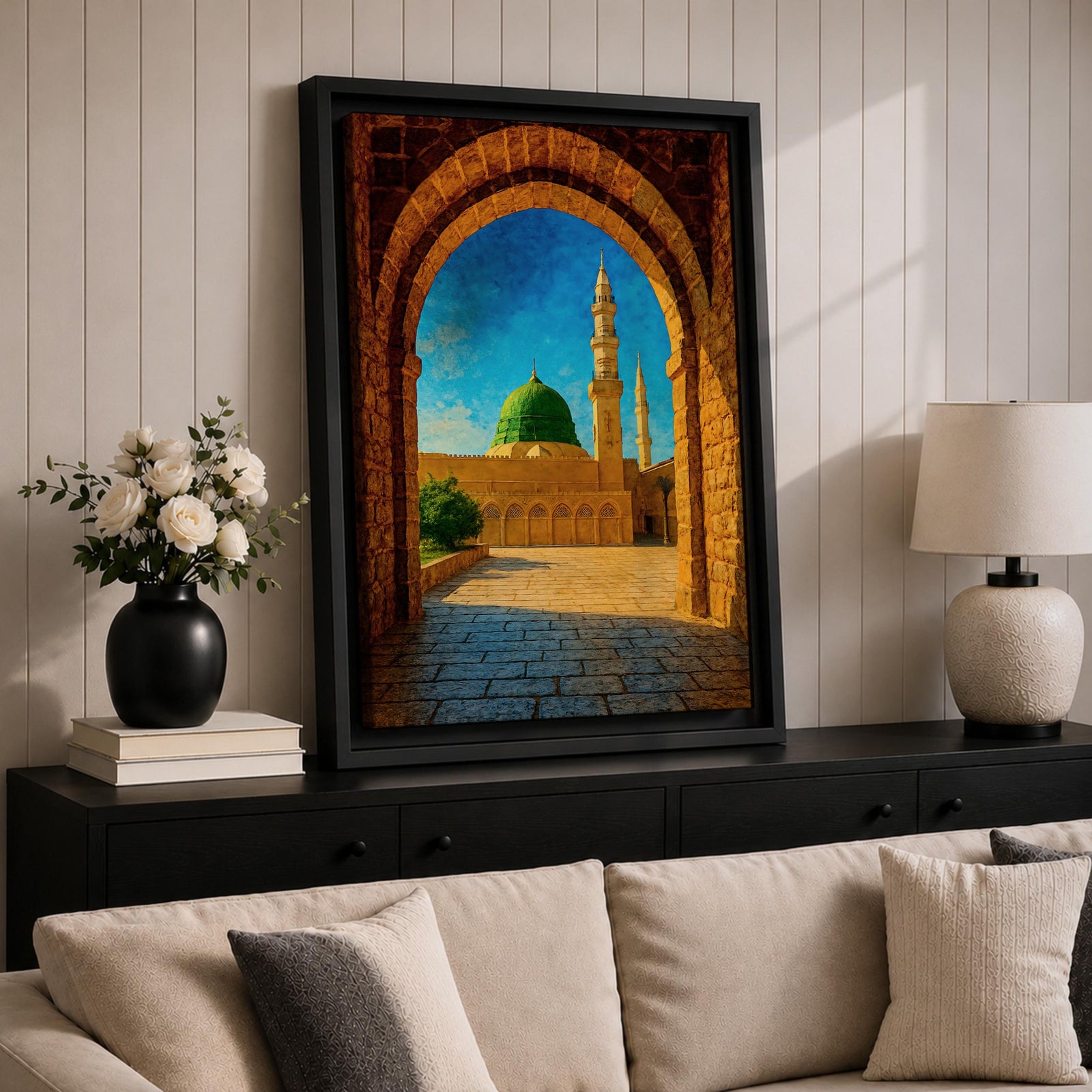 Artwork of Masjid Al Nabawi in Medina viewed through a historic stone archway with the iconic green dome and tall mosque minarets rising under a bright blue sky.