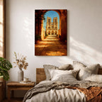 Painting of Notre Dame Cathedral in Paris framed through a large stone archway leading into a sunlit courtyard, showing the iconic twin towers and detailed Gothic façade in the distance, rendered in a warm impressionist style with golden light illuminating the architectural perspective and historic Paris landmark.