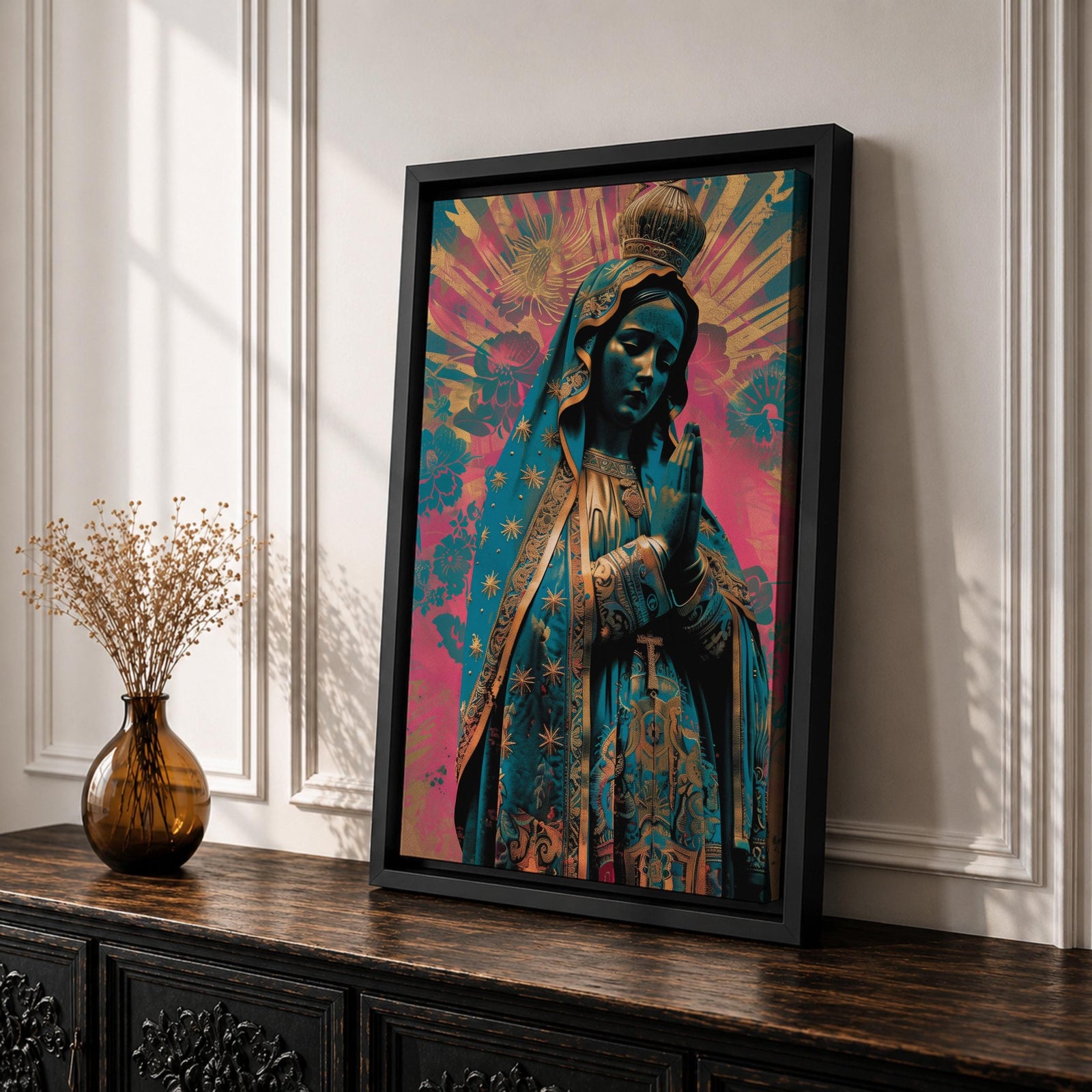 Retro style illustration of the Virgin Mary with hands folded in prayer, wearing a decorated blue mantle with star patterns and a crown, surrounded by radiant rays and floral graphic elements in bold pink and teal colors, rendered in a modern pop inspired Madonna composition with ornamental details.