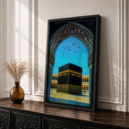 Artwork of the Kaaba in Masjid Haram framed by an ornate Moorish arabesque archway with intricate blue and gold patterns and birds flying across a bright sky above the mosque courtyard.