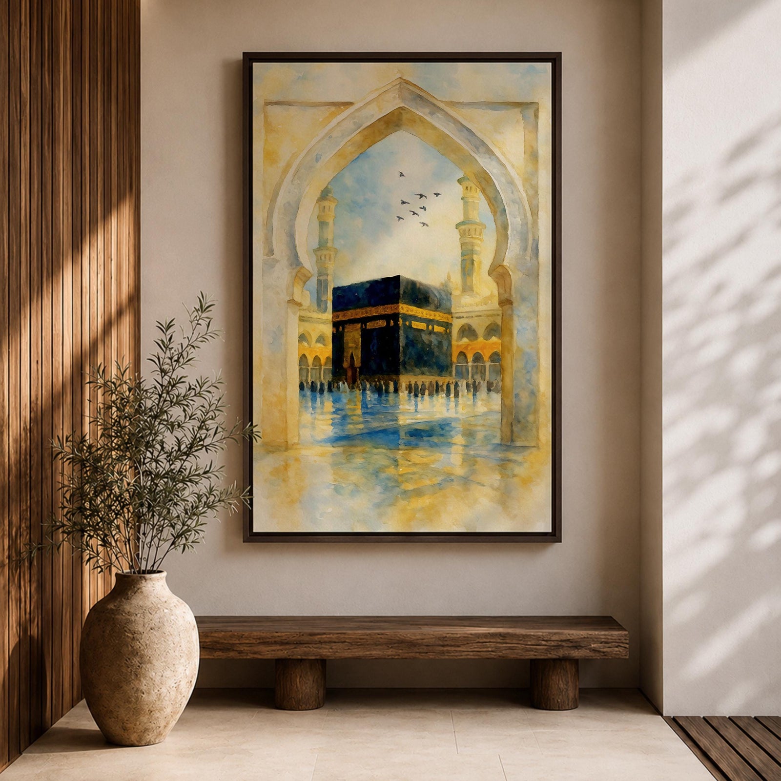 Soft watercolor artwork of the Kaaba at Masjid Al Haram framed by a Moorish pointed arch with mosque minarets and birds flying above the reflective courtyard.