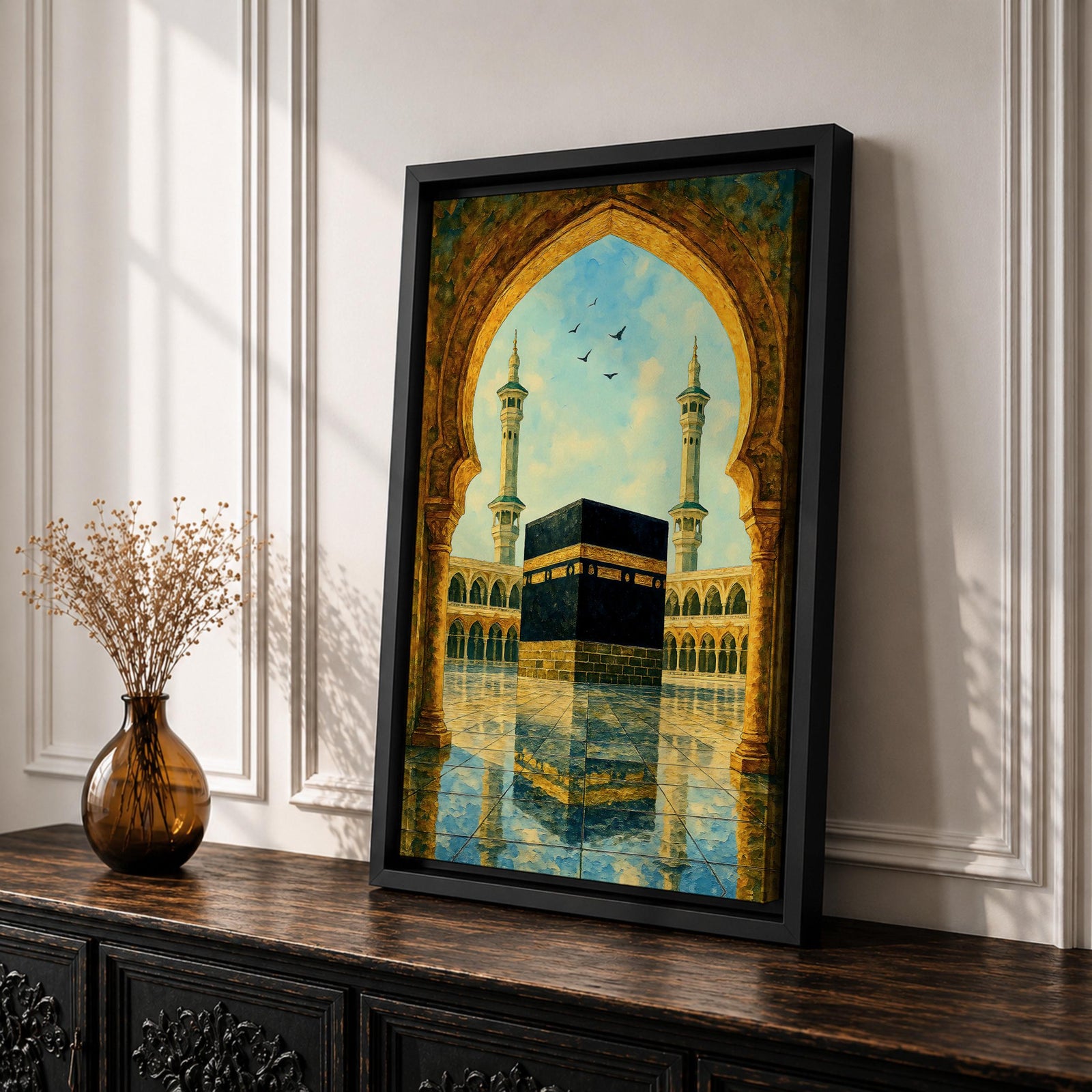 Artwork of the Kaaba in Masjid Haram viewed through an ornate Moorish arch with arabesque detailing, twin mosque minarets rising above the reflective courtyard beneath a soft blue sky.